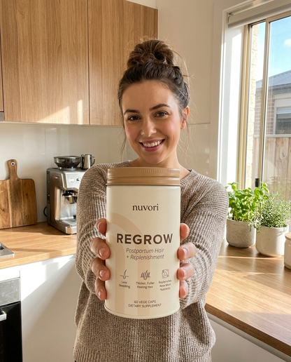 Happy mum holding her jar of Nuvori REGROW